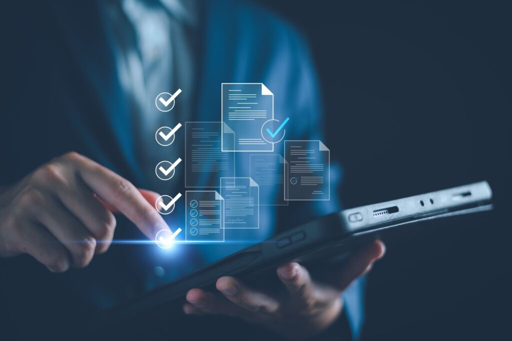 Person using a tablet with digital checklists and documents displayed in the air