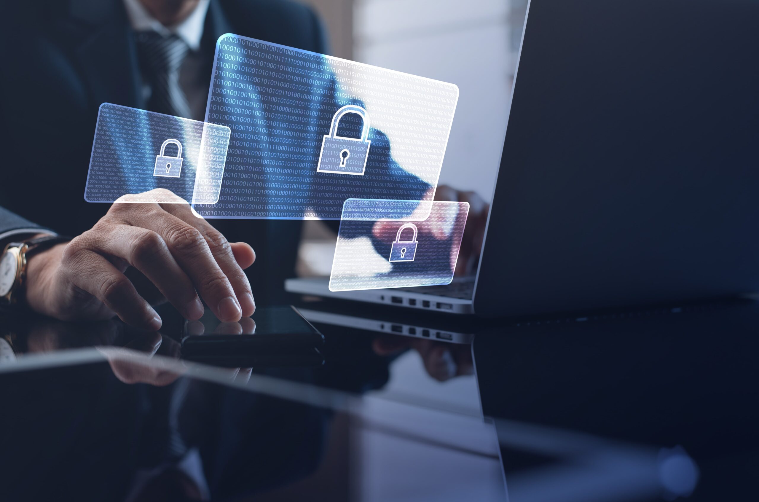 A person typing on a laptop with floating digital lock icons